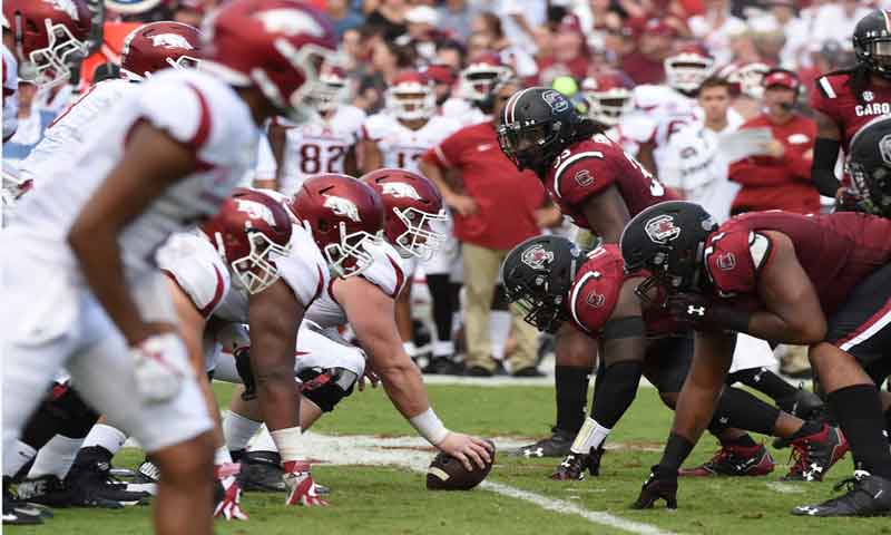 Hogs shuffle O linemen, work 2 QBs